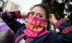 A woman participates in a march against gender violence in Quito, Ecuador.